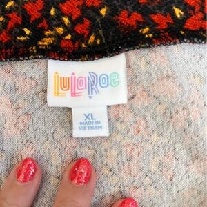 LuLaRoe Black Top with Red and Yellow Floral Design